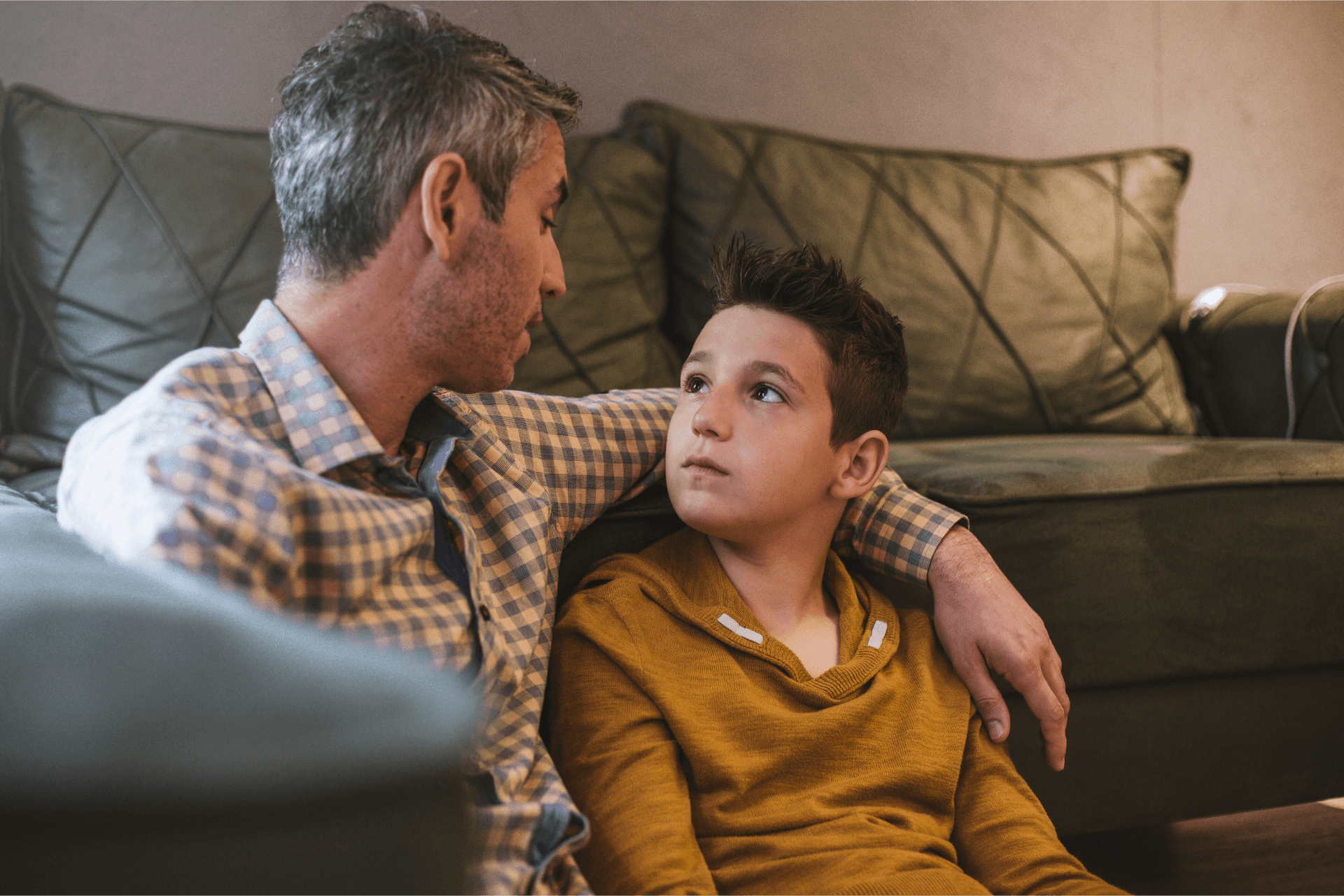 Dad and son talking on couch