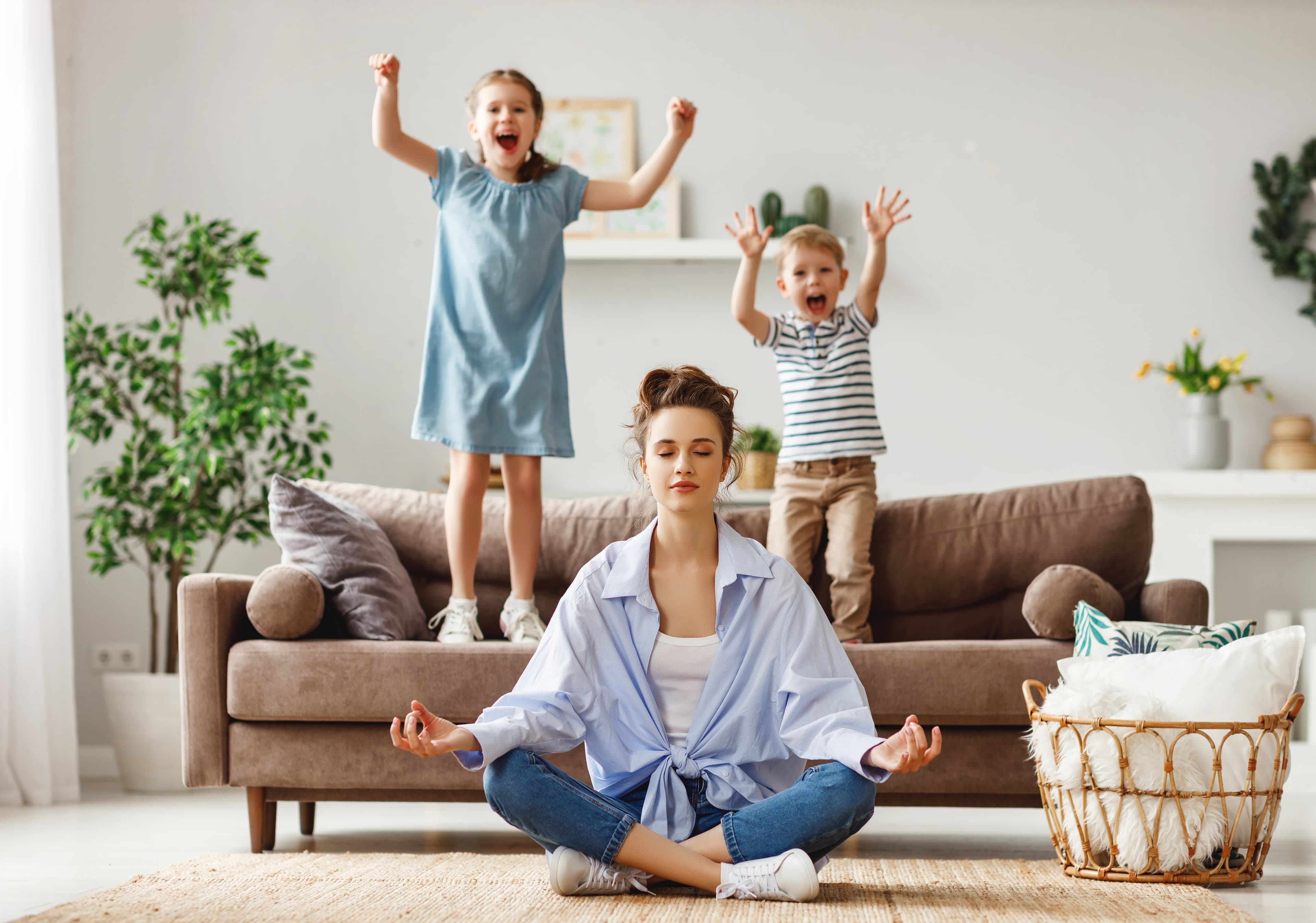 Mom doing meditation with kids