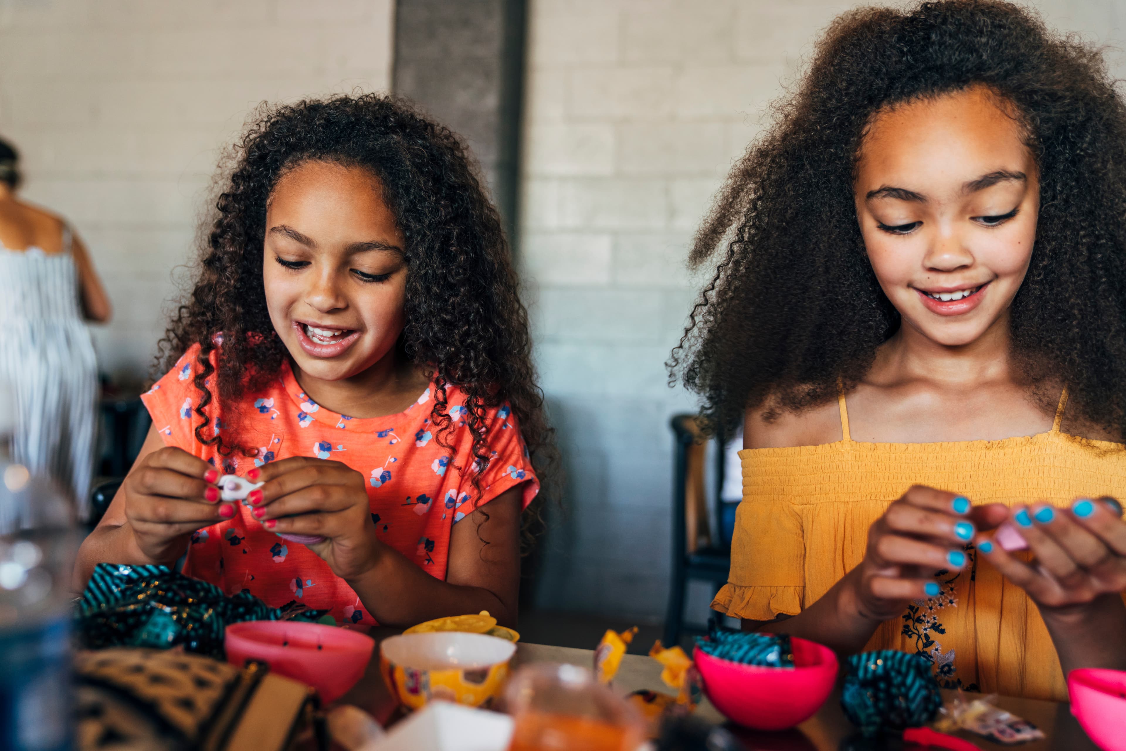 Two girls working on art