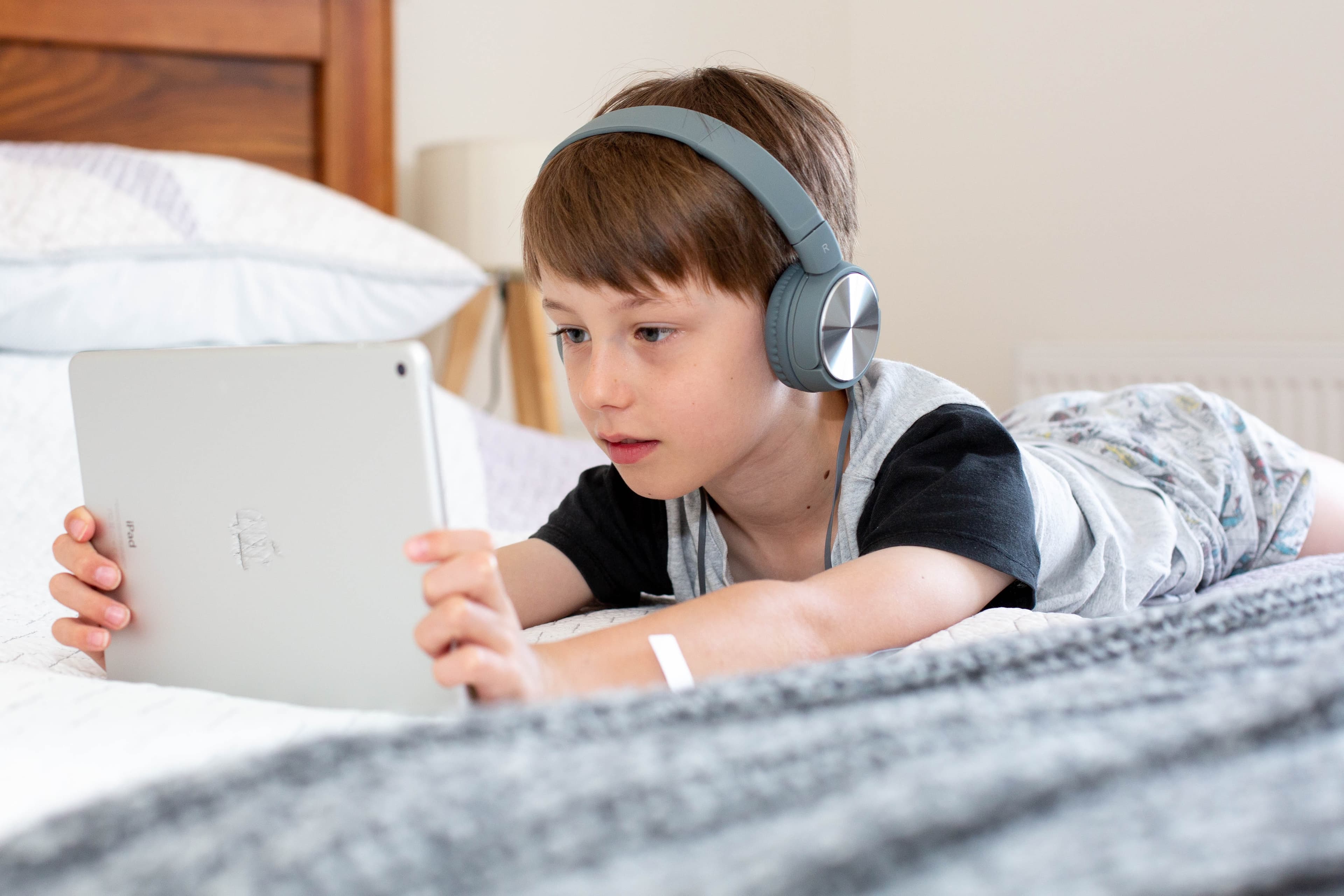 A young boy talks with a behavior health coach virtually, getting tailored strategies for growth and development.