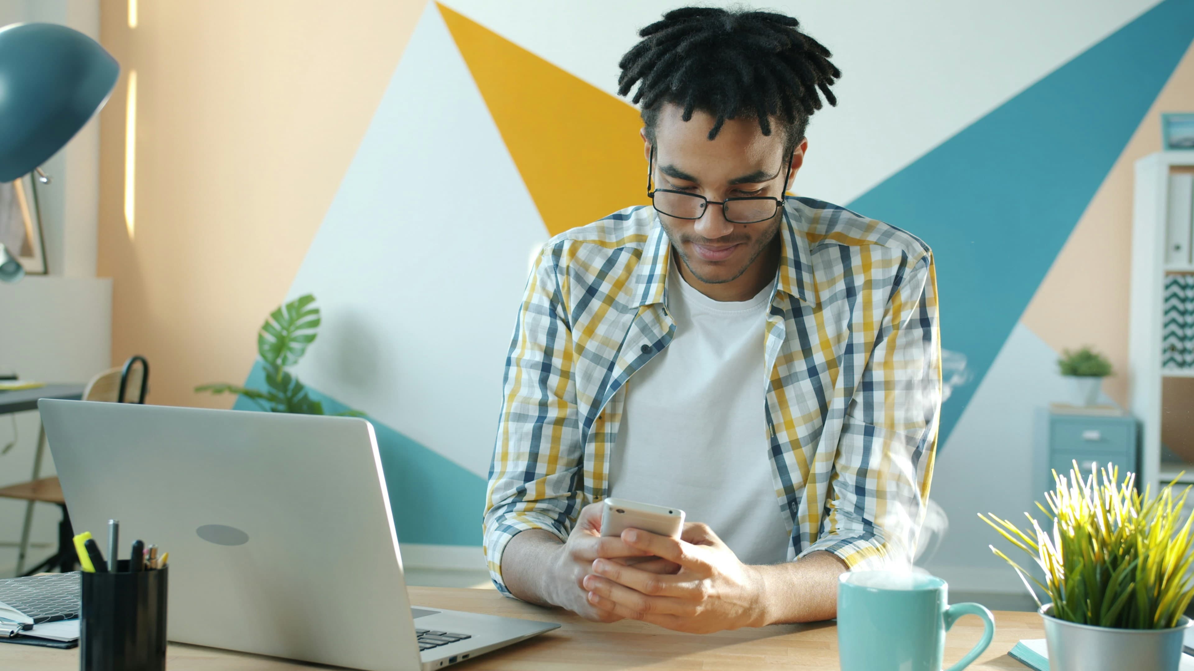 Young dad connecting online with others about parenting issues. Photo by Vitaly Gariev on Unsplash