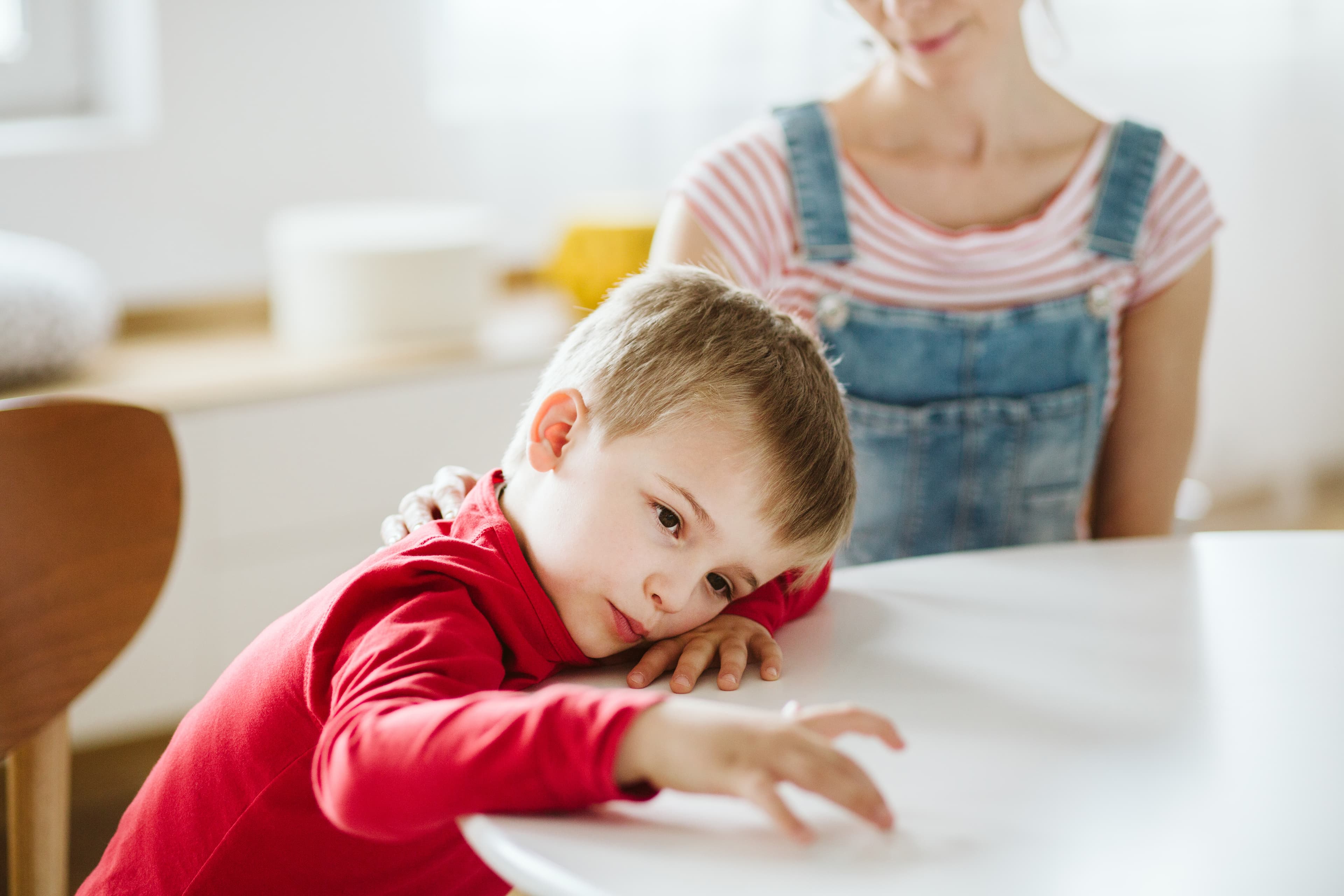 Boy at table not talking