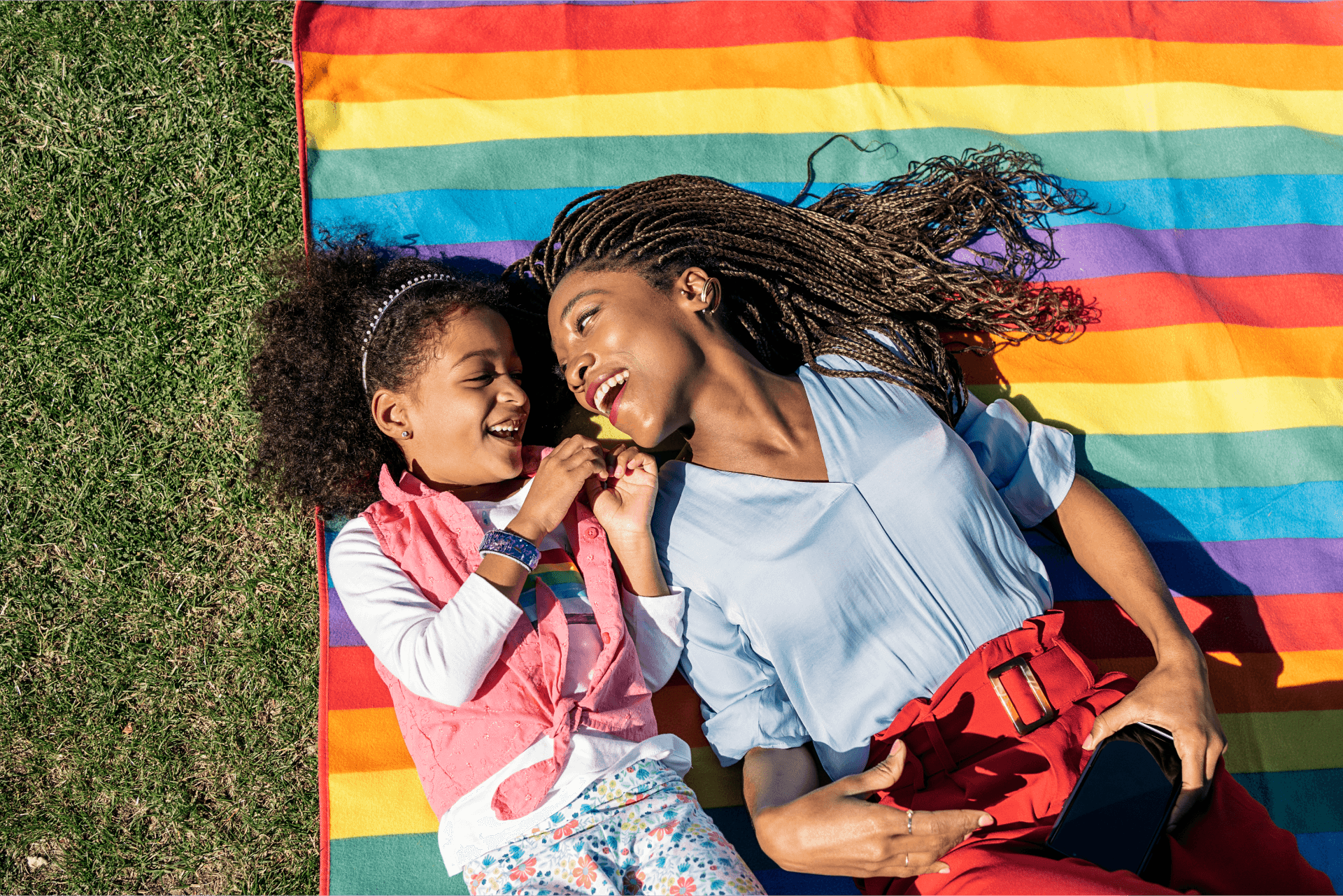 Pride flag and daughter and mom