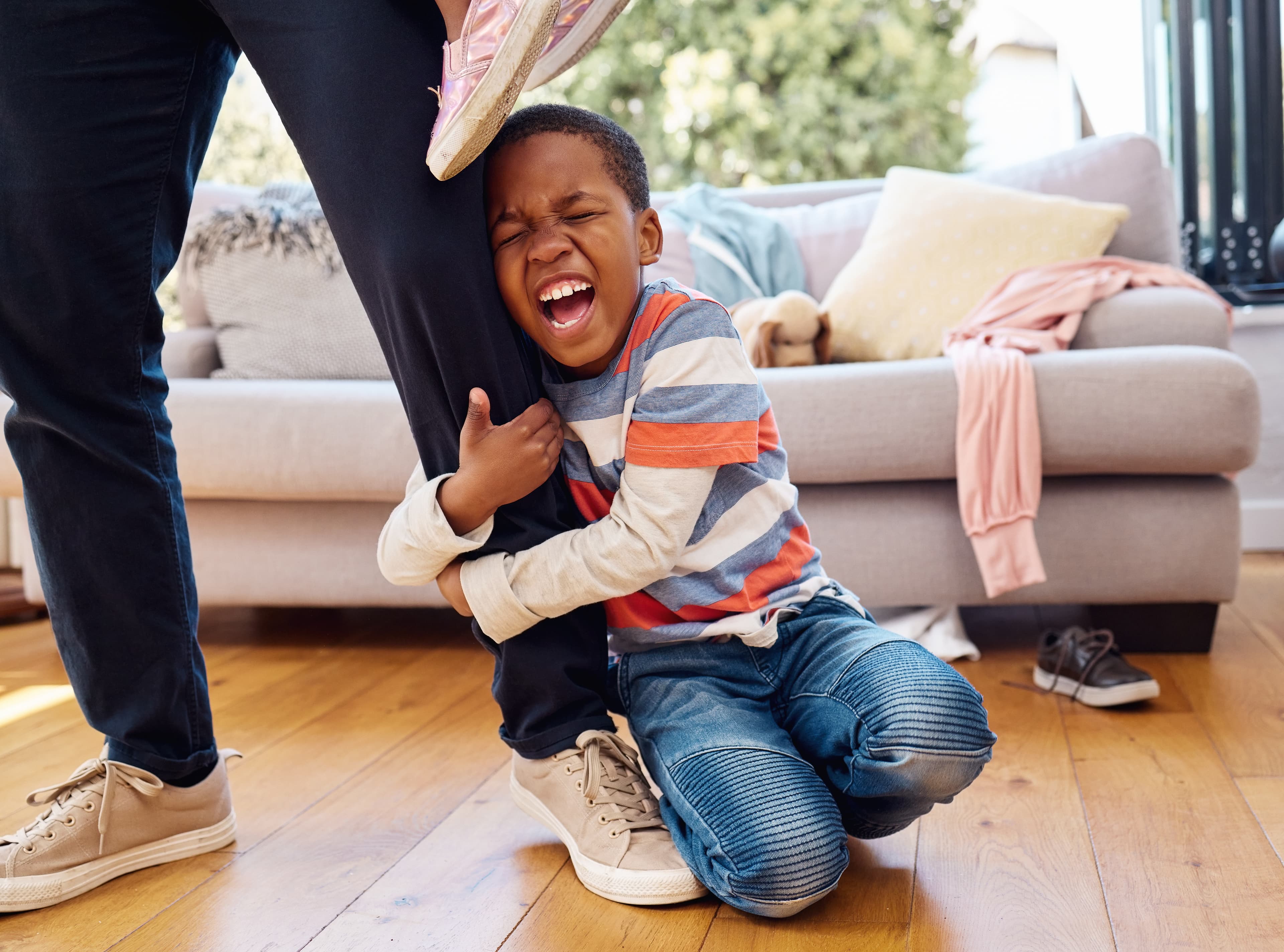 Boy in home on dad's leg